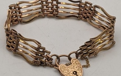 A 9ct gold rose gold gate line bracelet having...