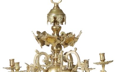 A Baroque style brass chandelier with six curved light arms. H. 48....