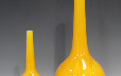 A Burmantofts art pottery bottle vase, circa 1882-1904, covered in a yellow glaze with incised decor