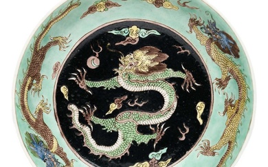 A CHINESE FAMILLE-NOIR 'DRAGON' DISH, KANGXI PERIOD (1662-1722)
