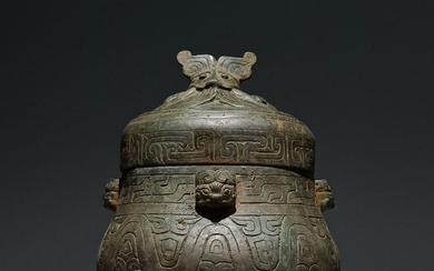 A Chinese Carved Bronze Jar with Cover