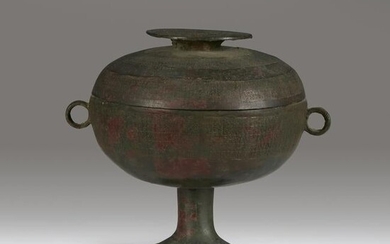 A Chinese archaic bronze ritual vessel and associated
