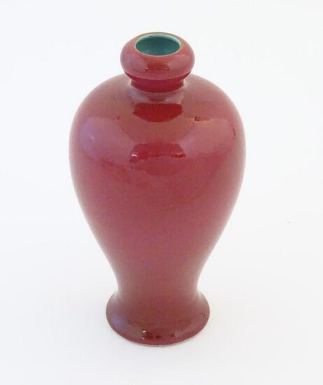 A Chinese baluster vase with a bulbous rim, with a ruby