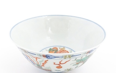 A Chinese bowl decorated with dragons, phoenix birds, flamin...