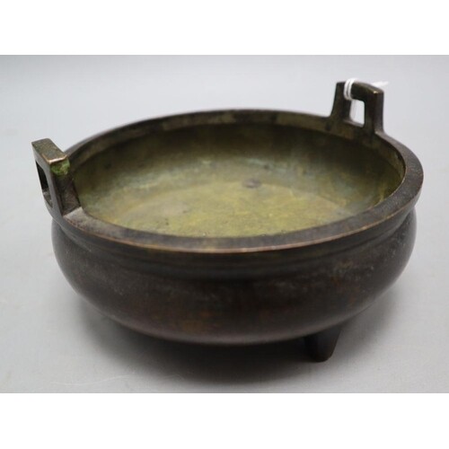 A Chinese bronze shallow tripod censer, Qianlong mark, late ...