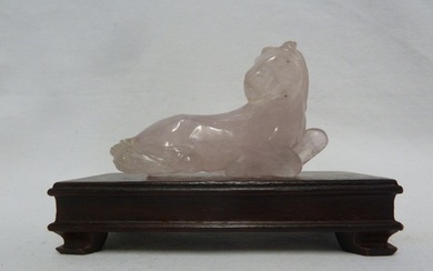 A Chinese carved rose quartz figure of a horse; and wooden s...