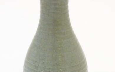 A Chinese celadon pear-shaped vase with a crackle