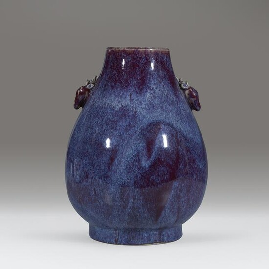 A Chinese flambe-glazed hu-form vase with deer-form