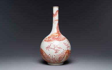 A Chinese iron-red-decorated and gilded 'dragon and carp' bottle vase, 19/20th C.