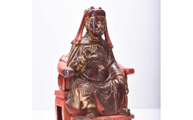 A Chinese painted and parcel gilt wood figure of a seated of...