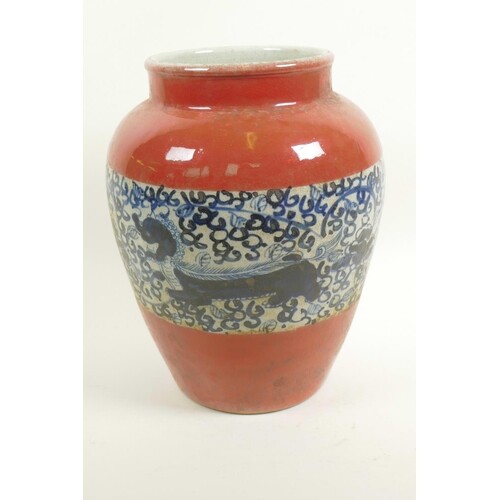 A Chinese porcelain baluster vase with red glaze and blue an...