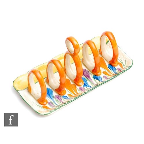 A Clarice Cliff toast rack or rounded rectangular form with ...