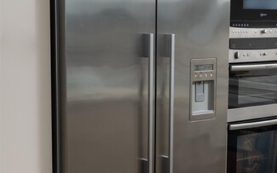 A Fisher & Paykel fridge/freezer, serial no. AUQ855263, series 1,...