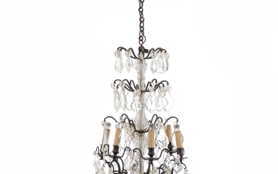 A French Régence style crystal chandelier with dark stained bronze frame. Electrical....