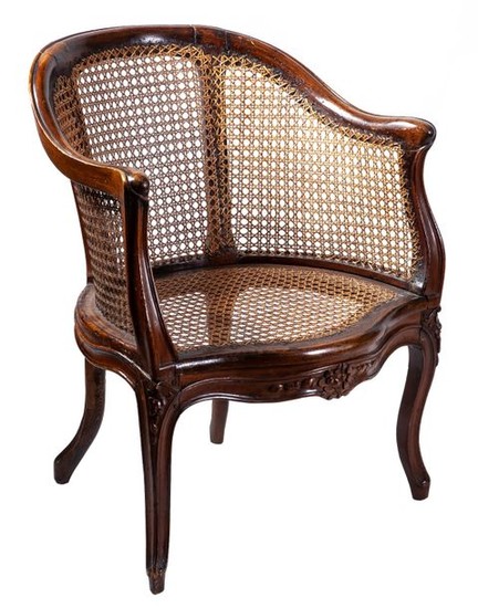 A French caned walnut bergère, 18th Century