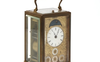 A French carriage clock made for the Russian market. Mid-19th century. H. 15 cm. W. 9,5 cm. D. 9 cm.