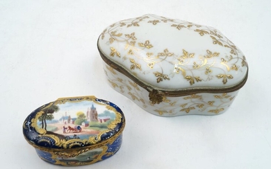 A French gilt-brass mounted enamel patch box, 19th century, of oval form, decorated with vignettes of rural scenes within scrolling gilt borders on a dark blue ground, approx. 3cm high, 5.6cm wide, 4cm deep, together with a Limoges gilt-brass...