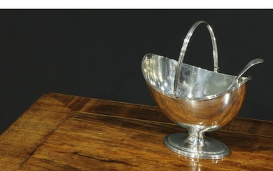 A George III silver boat shaped pedestal sugar basket, reede...