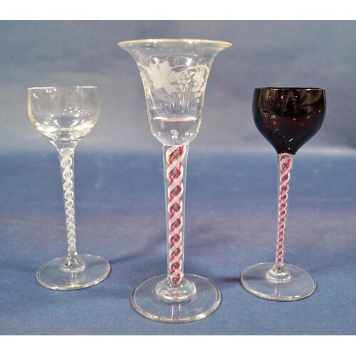 A Georgian stemmed wine glass with bell shaped bowl and engr...