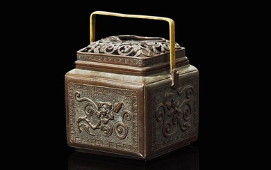A Japanese patinated bronze hand warmer, Edo to early Meiji period 銅加漆暖