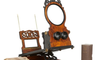 A LATE VICTORIAN WALNUT, EBONISED AND INLAID COMBINED STEREOSCOPE/GRAPHOSCOPE AND A COLLECTION OF STEREOSCOPIC CARDS