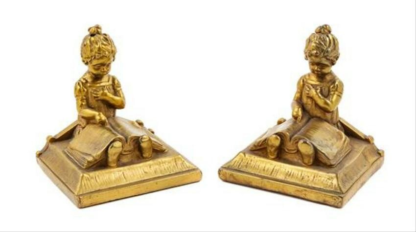 A Pair Of Gilt Metal Bookends Height 6 1/2 Inches.
