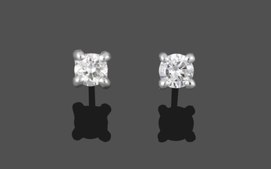 A Pair of 18 Carat White Gold Diamond Solitaire Earrings,...