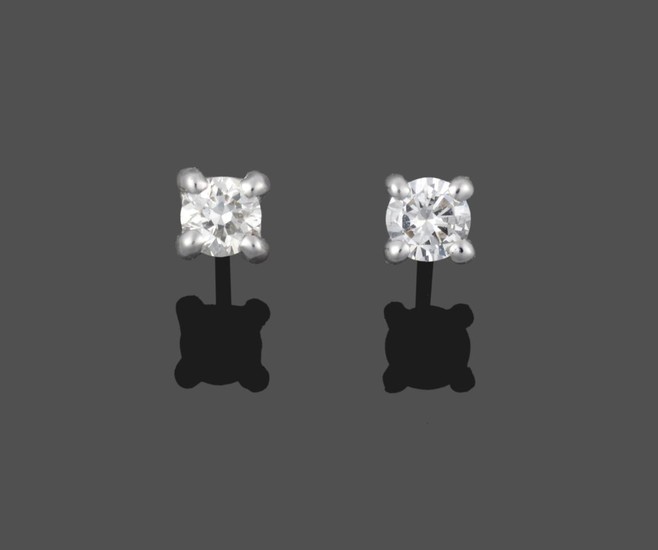 A Pair of 18 Carat White Gold Diamond Solitaire Earrings,...