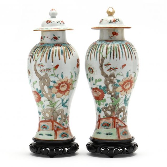 A Pair of Chinese Porcelain Covered Vases with Stands
