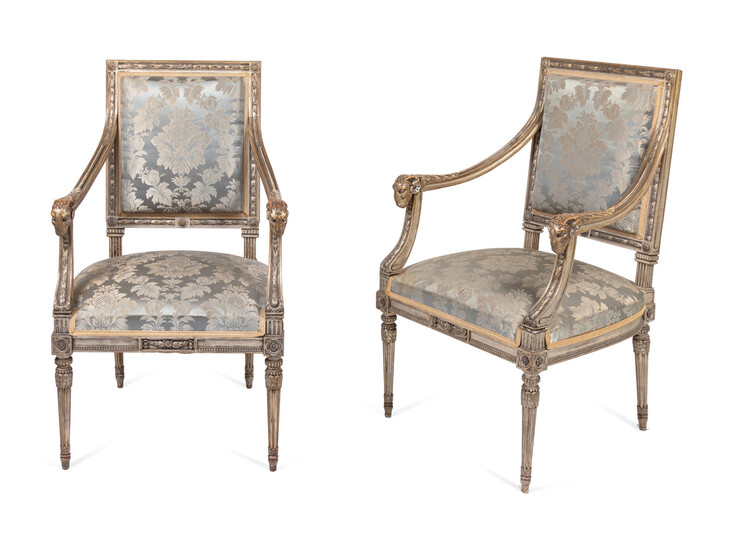 A Pair of Louis XVI Style Carved and Silver Paint Decorated Fauteuils