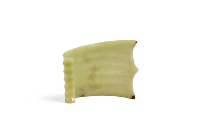 A RARE NEOLITHIC PALE GREEN JADE CURVED AND RIBBED ORNAMENT...