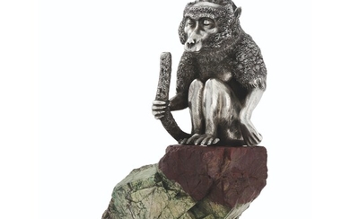 A SILVER TABLE LIGHTER IN THE FORM OF A SEATED BABOON