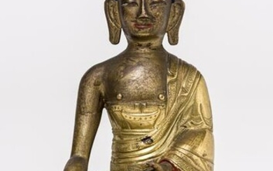 A SINO-TIBETAN GILDED BRONZE BUDDHA SHAKYAMUNI