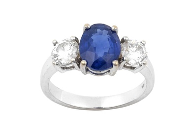 A Sapphire and Diamond Three Stone Ring the oval cut...