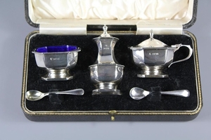 A Silver Cruet Set, comprising a salt, pepper and mustard, B...