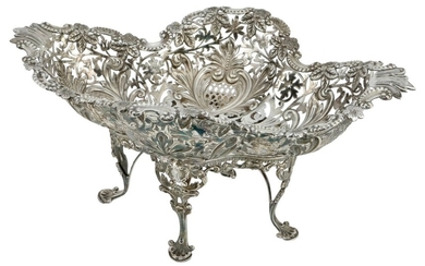 A Silver Decorative Sweet Meat Basket On four scallop style feet and crossed stretchers. Hall...