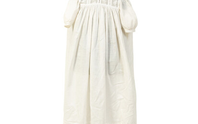 A Victorian Child's Mannequin Dressed in a White Christening Dress