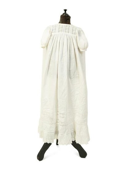 A Victorian Child's Mannequin Dressed in a White