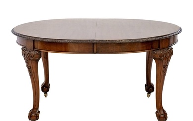 A Victorian mahogany extending dining table. With D ends on ...