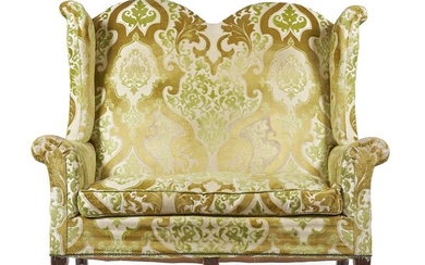 A WALNUT AND UPHOLSTERED WING BACK SOFA IN WILLIAM & MARY STYLE, LATE 19TH CENTURY