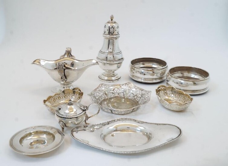 A collection of silver, to include: a twin handled sauce boat and stand, Chester, 1906, Barker Brothers (Herbert Edward Barker & Frank Ernest Barker), of shaped oval form with pierced loop handles and beaded rim on oval foot, the stand with...