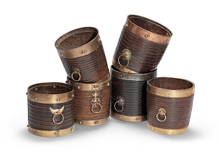 A collection of six turned teak, brass and copper wine coolers and planters
