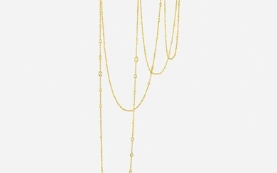 A diamond and eighteen karat gold long chain
