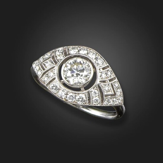 A diamond bombé ring, centred with a round brilliant-cut diamond...