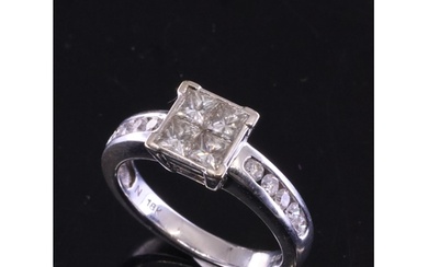 A diamond cluster ring set in 18kt gold total weight 1ct fin...