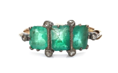 A gold and silver, emerald and diamond ring