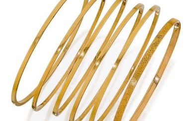 A group of six early 20th century gold bangles, including five of square section design and one of flattened band design (6)