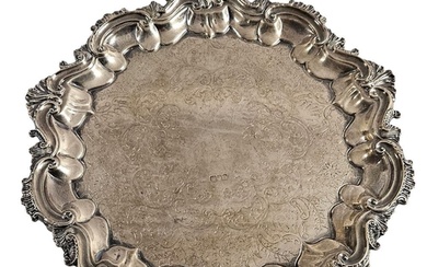 A hallmarked silver circular salver with engraved decoration...
