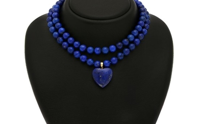 A lapis lazuli jewellery set comprising two clasps, two necklaces and a hinged pendant in the shape of a heart. (5)