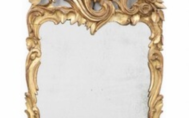 NOT SOLD. A large south German rococo giltwood mirror adorned with openwork grapes and wine leaves. Mid-18th century. H. 165 cm. W. 54 cm. – Bruun Rasmussen Auctioneers of Fine Art